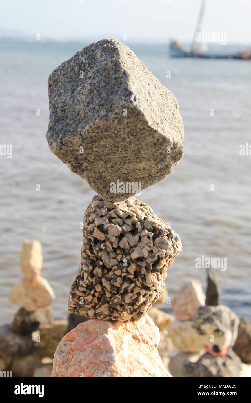 stones balanced on the seashore Stock Photo
