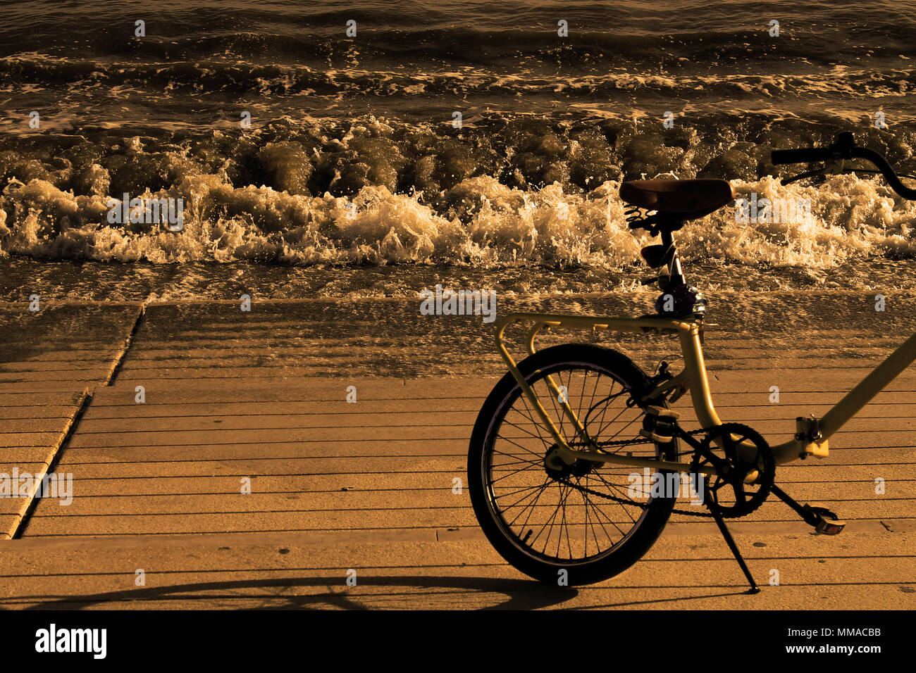 bicycle on the seashore in sepia style Stock Photo