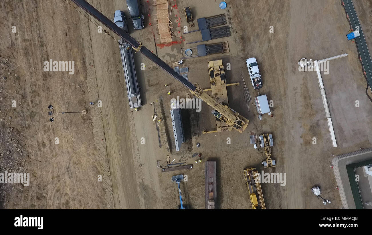 An aerial view of a worksite being set up near the Otay Mesa Port of Entry outside of San Diego, California, shows crews laying the groundwork for construction of prototypes of the proposed border wall between the United States and Mexico October 3, 2017. U.S. Customs and Border Protection Photo Stock Photo