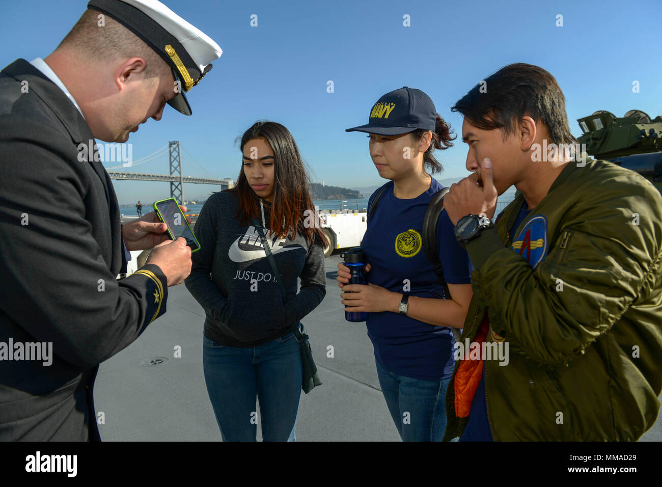 SAN FRANCISCO (Oct. 4, 2017) Lt. j.g. Raymond Wettstein shows a picture of an MV22 Osprey to a