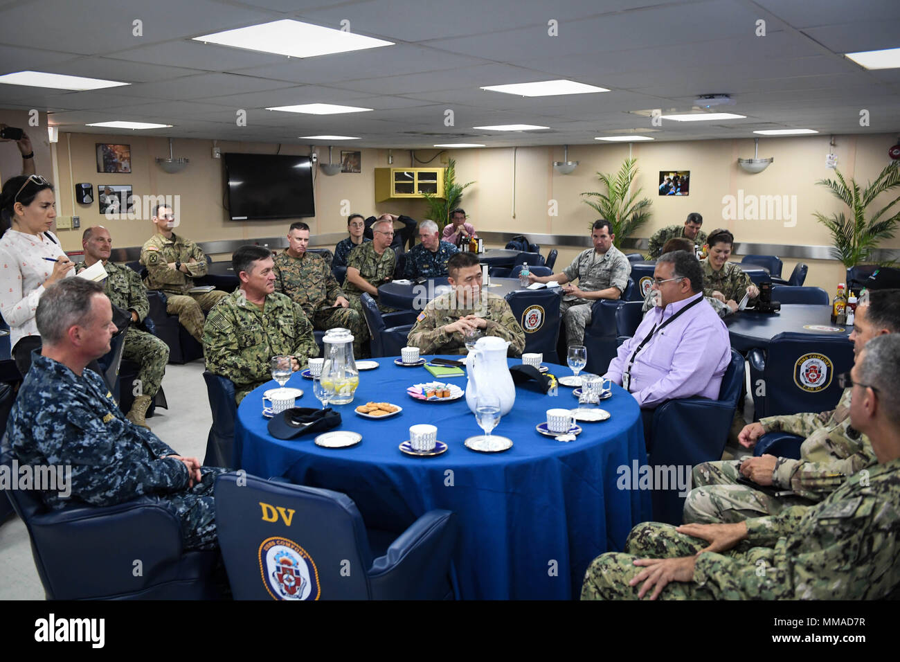 171004-N-ZN152-0026 SAN JUAN, Puerto Rico (Oct. 4, 2017) - Brig. Gen. Rich Kim, Army North's deputy commander (center), discusses the capabilities of the Military Sealift Command hospital ship USNS Comfort (T-AH 20) with Capt. Kevin Robinson, Comfort's mission commander (left), Capt. Kevin Buckley, commanding officer, Comfort's medical treatment facility (far left),  Dr. Rafael Rodriguez Mercado, Puerto Rico Secretary of Health, and other local and federal stakeholders while the ship is in Puerto Rico to synchronize efforts for providing humanitarian assistance throughout the area. The Departm Stock Photo
