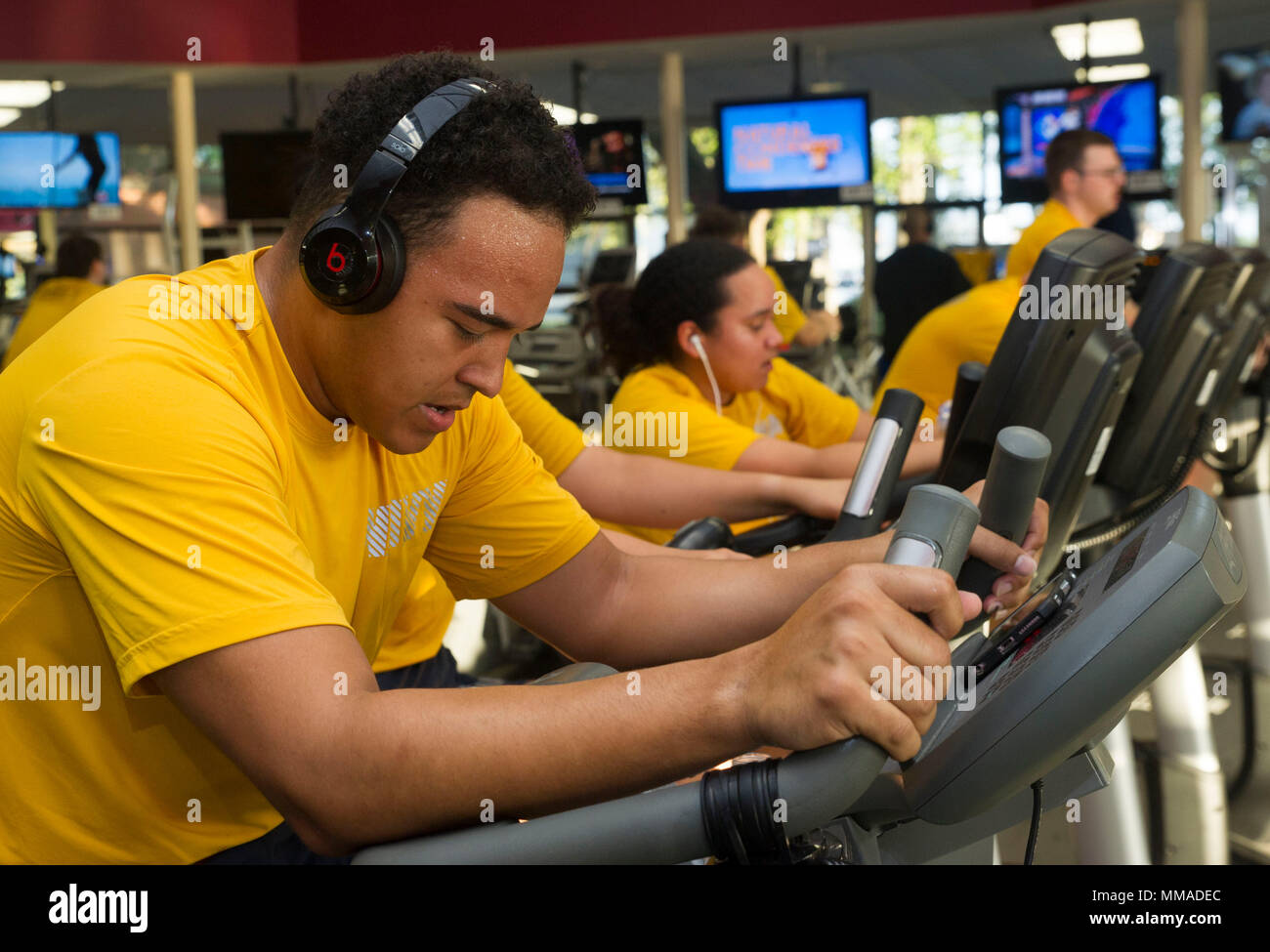 170922-N-KC543-063  NORFOLK (Sept. 22, 2017) Information Systems Technician 3rd Class Shandon Williams uses a stationary bike during a physical fitness test for the Nimitz-Class aircraft carrier USS George Washington (CVN 73). George Washington is undergoing a refueling and complex overhaul (RCOH) at Newport News Shipyard. RCOH is a four-year project performed only once during a carrier’s 50-year service life that includes refueling of the ship’s two nuclear reactors, as well as significant repair, upgrades and modernizations. (U.S. Navy photo by Mass Communication Specialist 2nd Class Alora R Stock Photo