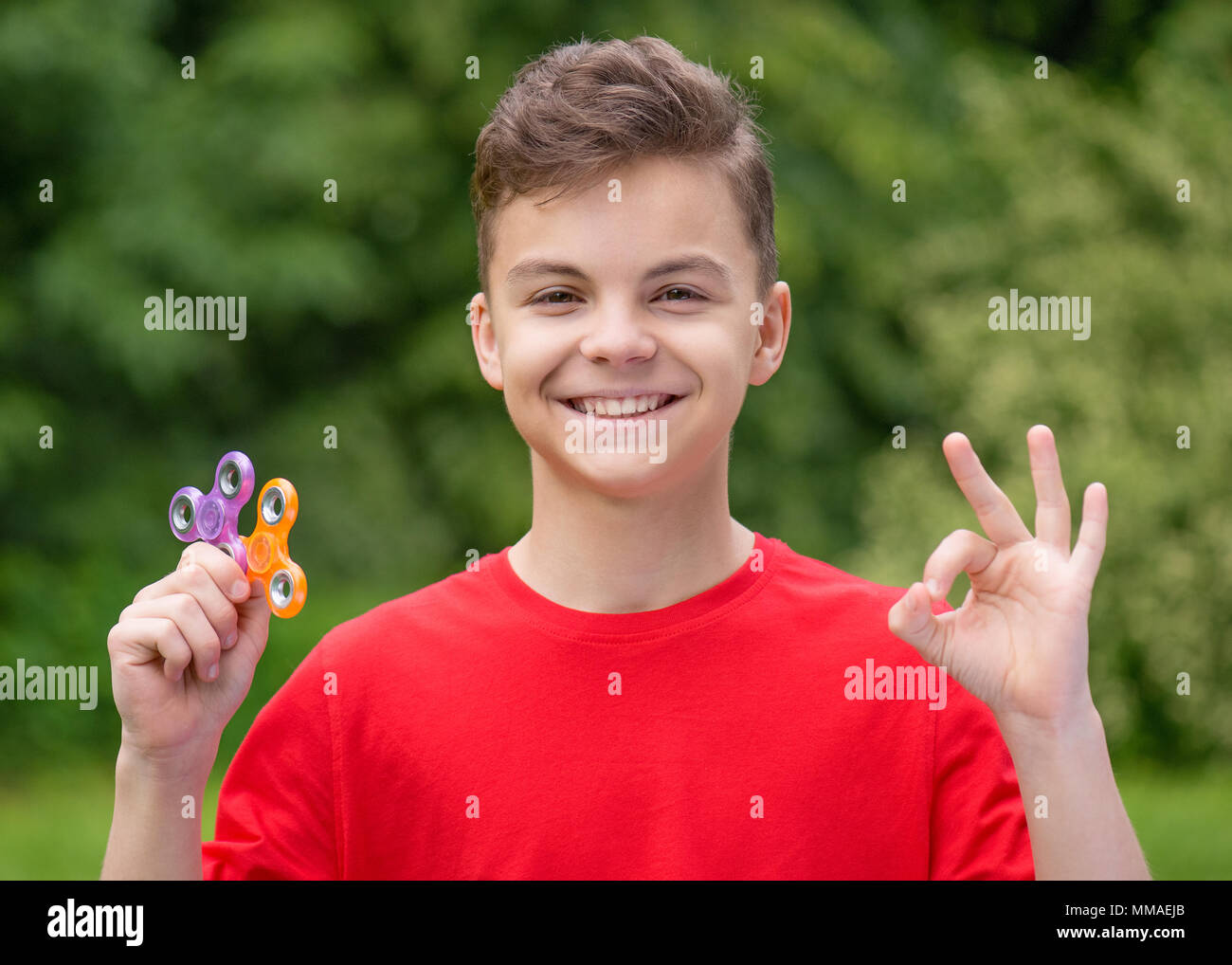 Teen boy with spinner Stock Photo