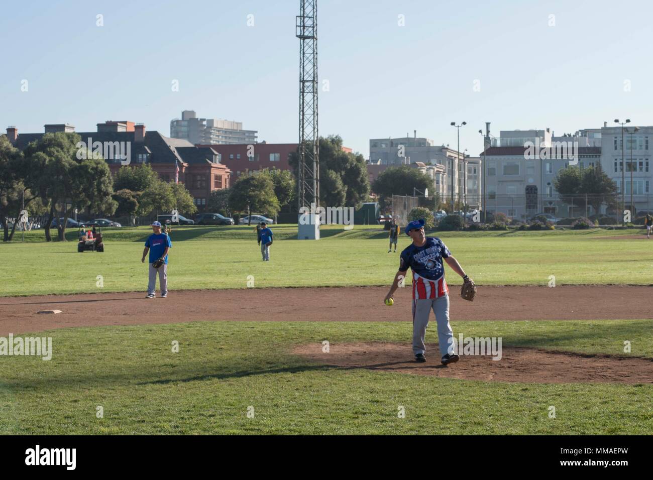 SAN FRANCISCO (Oct. 5, 2017) U.S. Coast Guard personnel play against members of the Oakland Police Department at a softball tournament during Fleet Week San Francisco.  Fleet week provides an opportunity for the American public to meet their Navy, Marine Corps, and Coast Guard team and to experience America's sea services, highlighting naval personnel, equipment, technology, and capabilities, with an emphasis on humanitarian assistance and disaster response.  (U.S. Navy photo by Mass Communication Specialist 2nd Class Chelsea Troy Milburn) Stock Photo