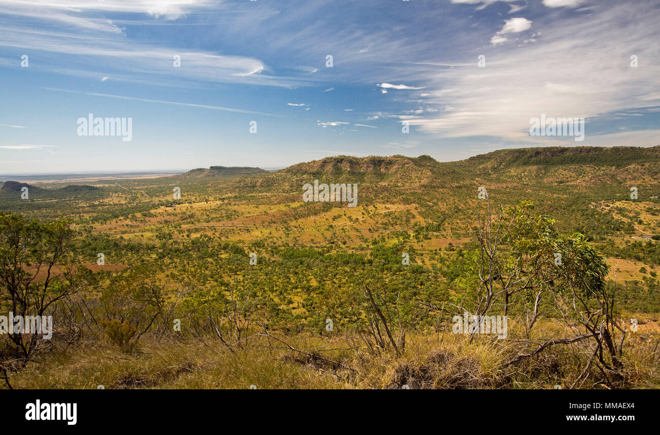 View of vast outback landscape of ranges and plains under blue sky from lookout at Minerva Hills National Park, near Springsure Queensland Australia Stock Photo