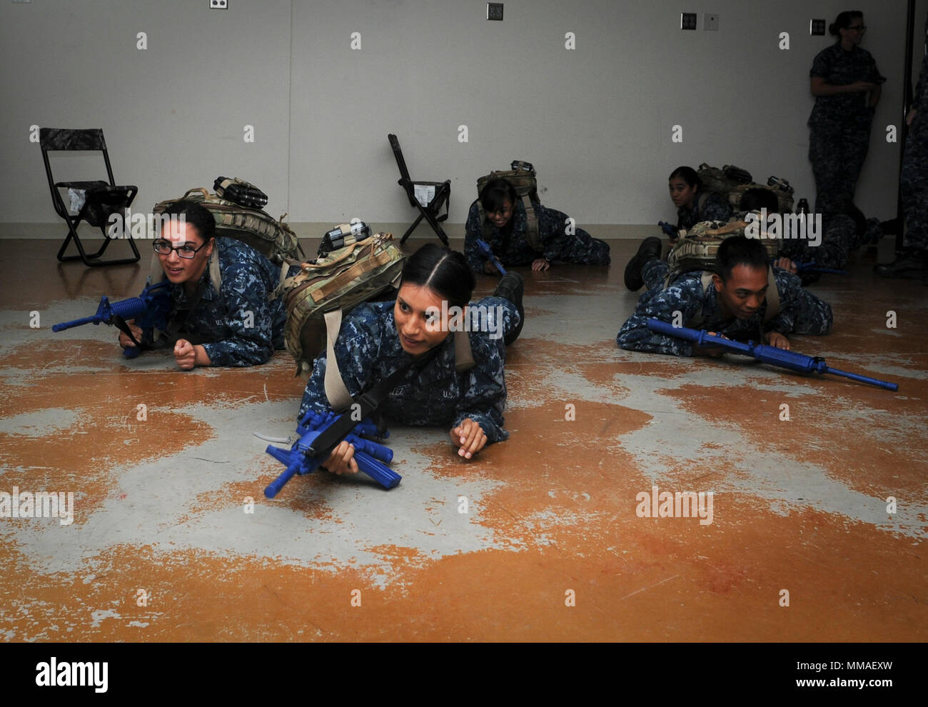 SAN ANTONIO (Oct. 5, 2017) Hospital corpsman (HM) "A" School students crawl  into a simulated combat environment during a final exercise at the Medical  Education and Training Campus on board Joint Base