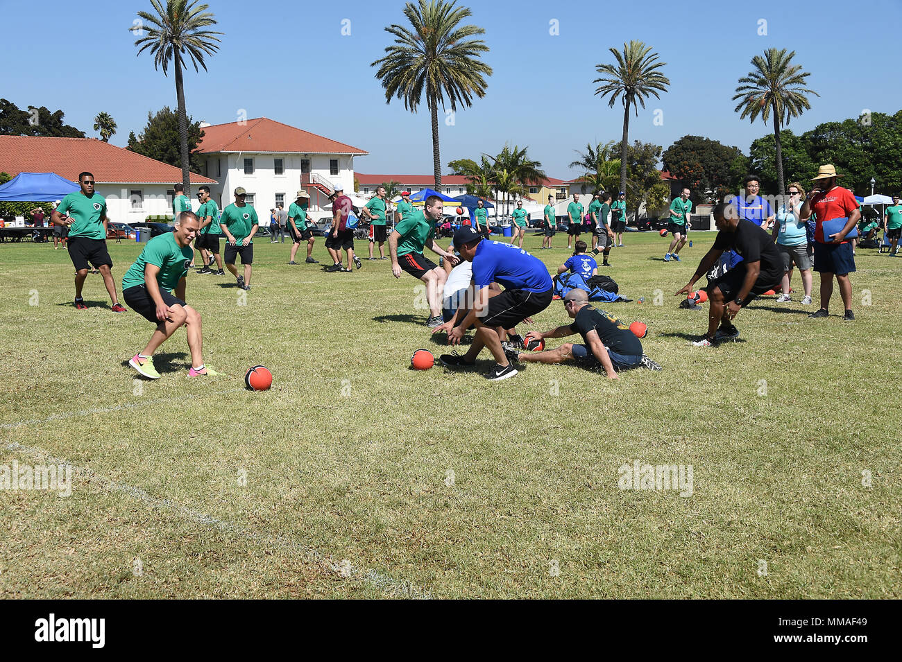 Military and Air Force civilian employees at Los Angeles Air Force Base, 61st Air Base Group and Space and Missile Systems Center, Calif., gather at the Fort MacArthur parade field in San Pedro, Calif. Oct. 4, 2016, to participate in “Sports Day” for spirited squadron and inter-directorate competition in a variety of sports venues. The games foster physical, mental, and spiritual health and well-being, and a chance to win over-all points for the unit trophy, not to mention bragging rights between the SMC Directorates and 61st ABG. Lt Gen John Thompson, Space and Missile Systems Center, Directo Stock Photo