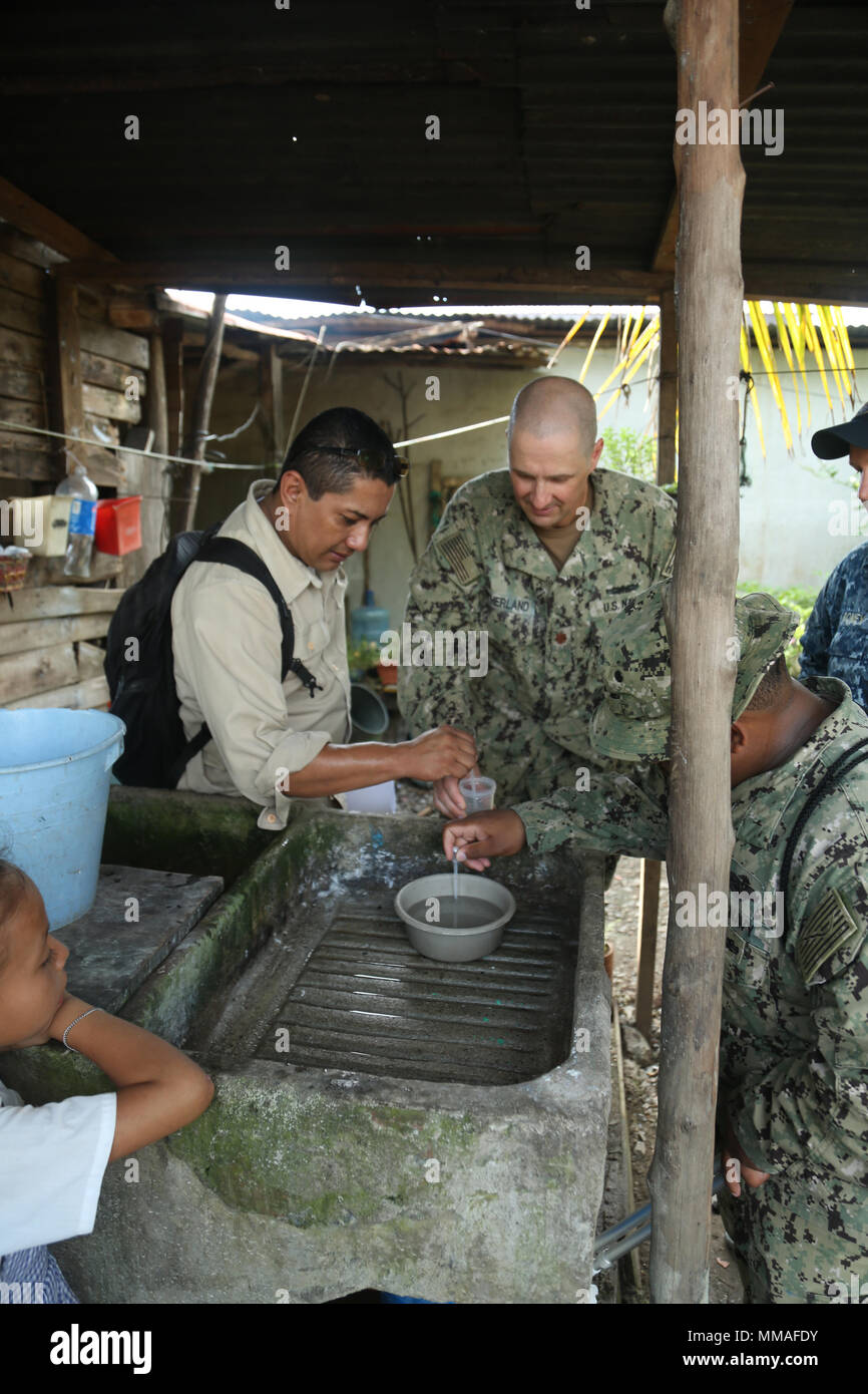 171003-A-NY041-0209 PUERTO BARRIOS, Guatemala (Oct. 3, 2017) U.S. Navy Lt. Cmdr. Ian Sutherland, technical director for Navy Entomology Center of Excellence, and Dr. Hector Soriano, head of entomology and vector control for Department of Izabal, investigate local neighborhoods as part of insect and disease control efforts, during Southern Partnership Station 17 (SPS 17). SPS 17 is a U.S. Navy deployment, executed by U.S. Naval Forces Southern Command/U.S. 4th Fleet, focused on subject matter expert exchanges with partner nation militaries and security forces in Central and South America. (U.S. Stock Photo