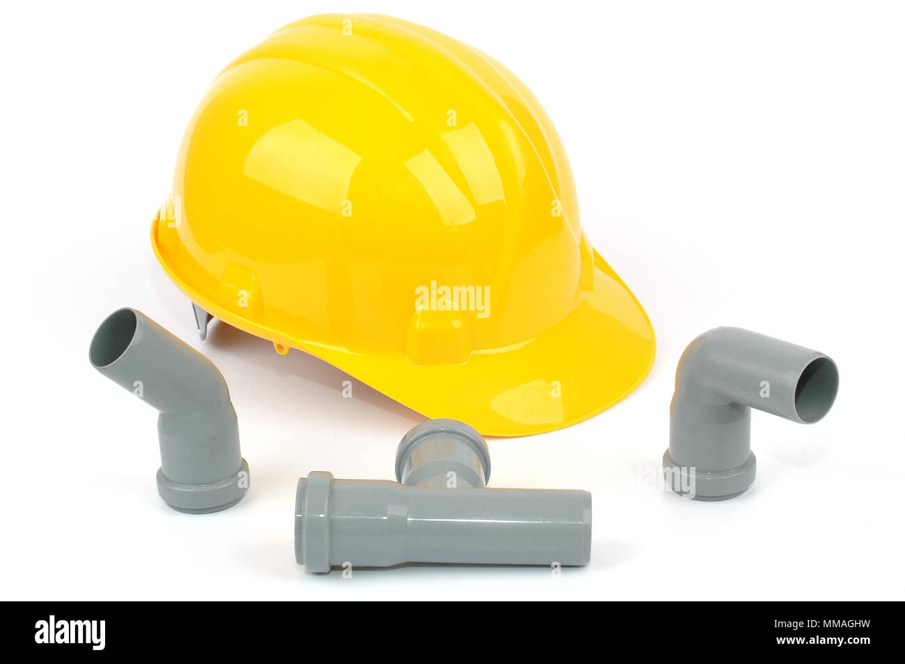 photo of various PVC fittings for drainage used in water distribution  systems and yellow safety helmet, bathroom renovation concept Stock Photo -  Alamy