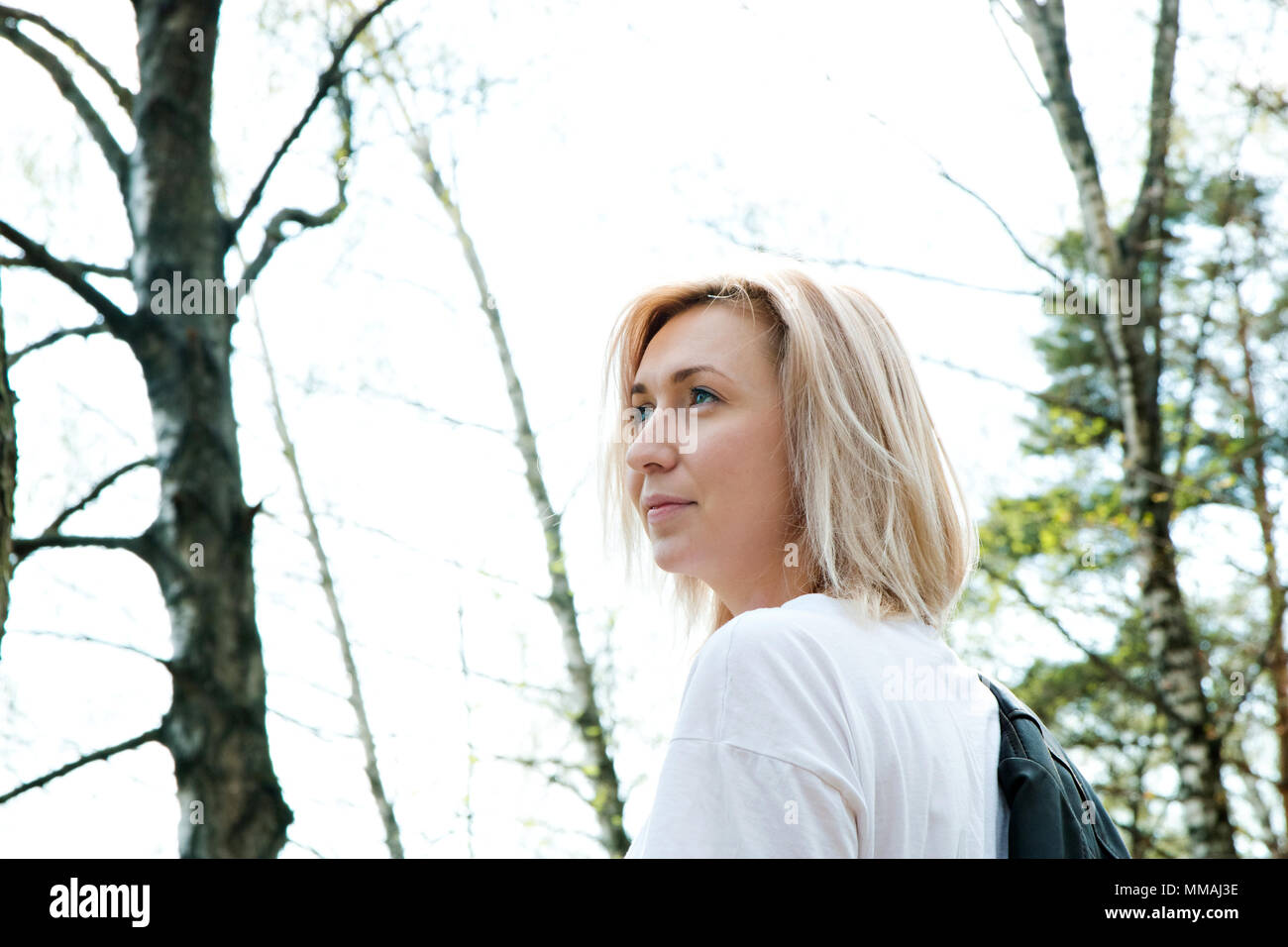 Portrait of blonde young girl in the forest Stock Photo - Alamy