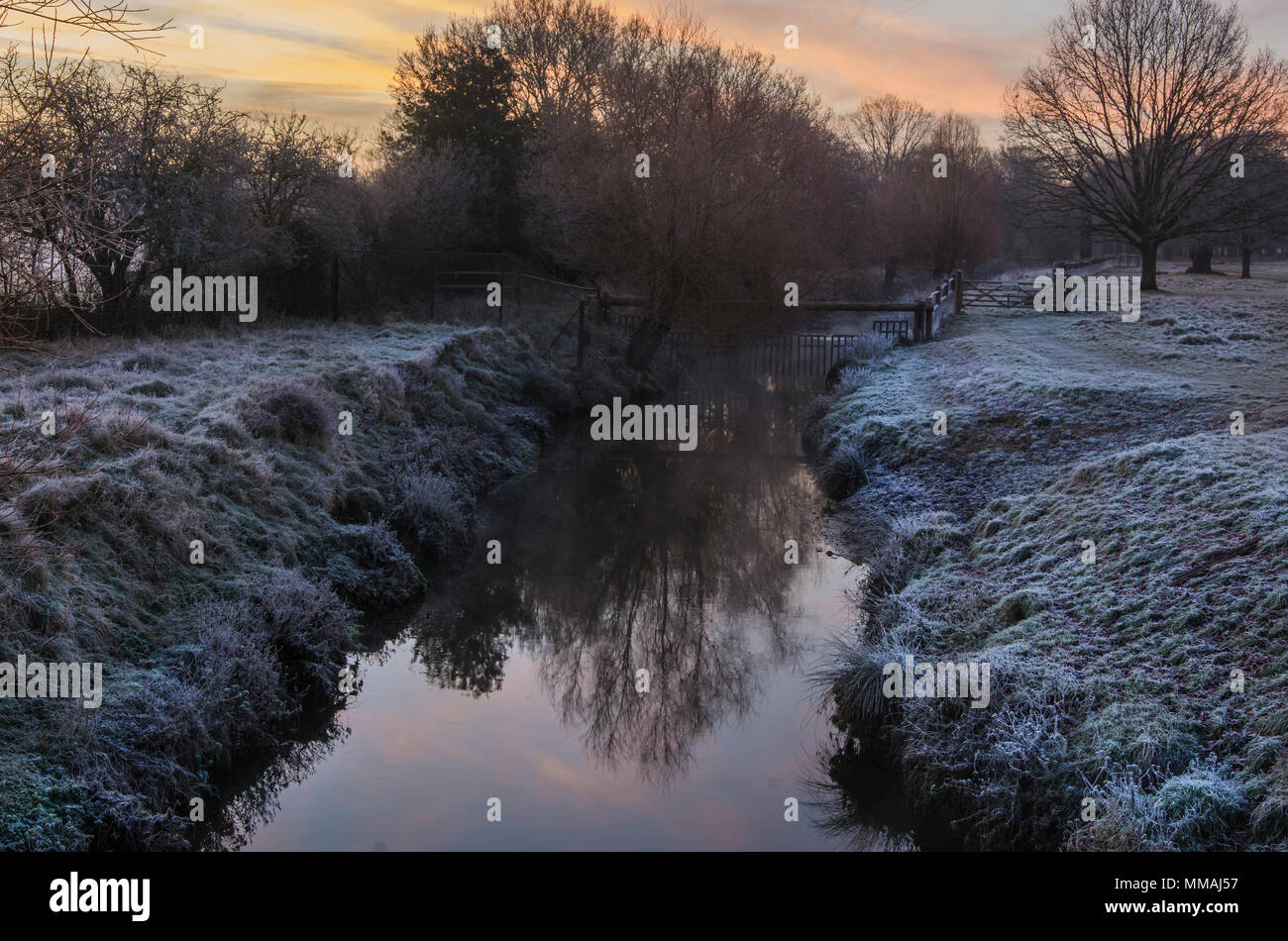 Frosty sunrise over a stream Stock Photo