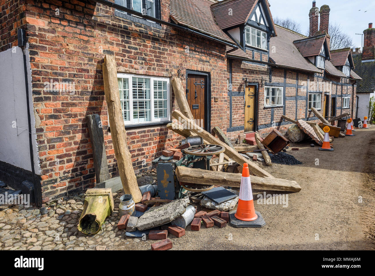 Props and debris litter alongside cottages for  the new BBC drama 'War Of The Worlds' by HG Wells,filmed at Great Budworth village, Cheshire, April 20 Stock Photo