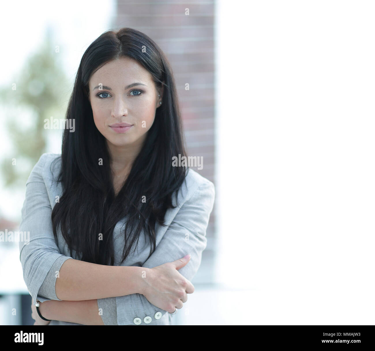 successful young business woman on the office background Stock Photo ...