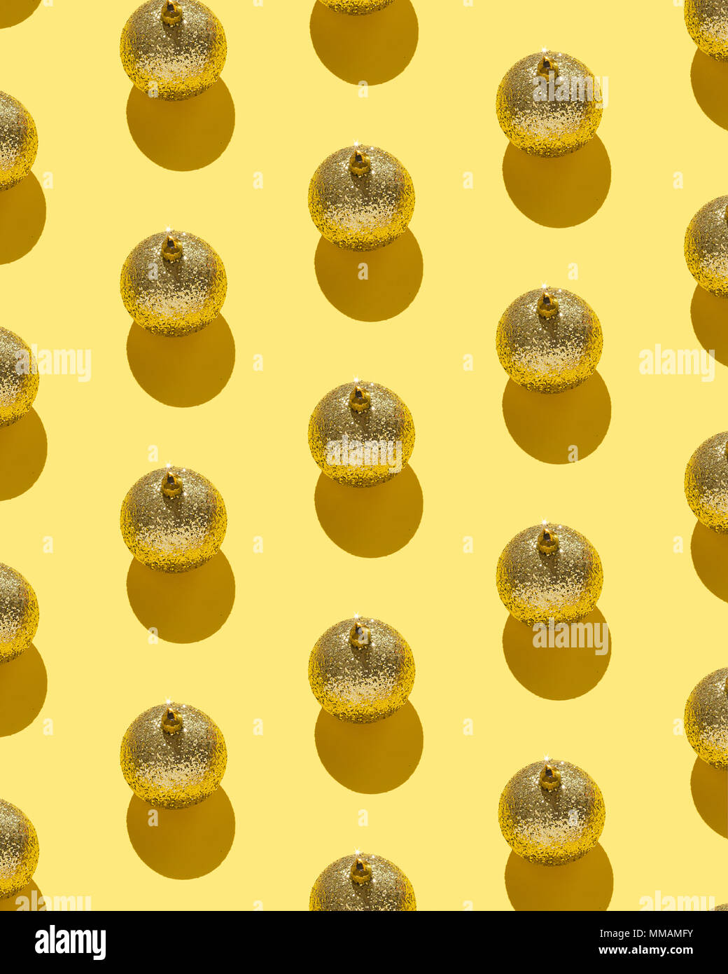 Christmas baubles organized over yellow background Stock Photo