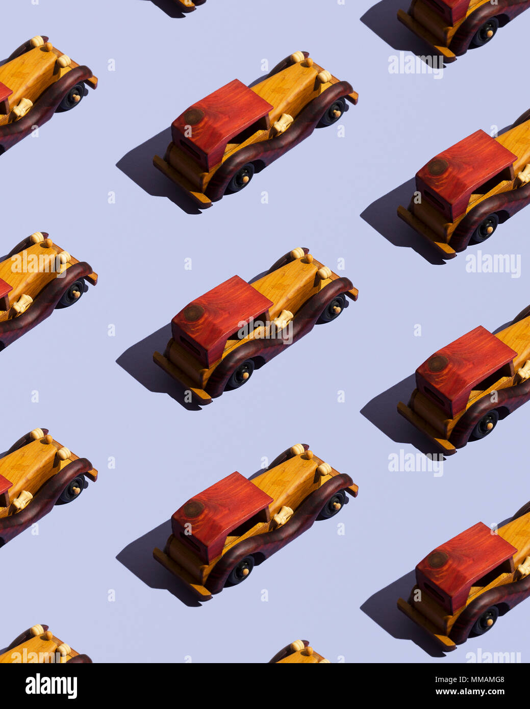 Wooden cars organized over blue background Stock Photo