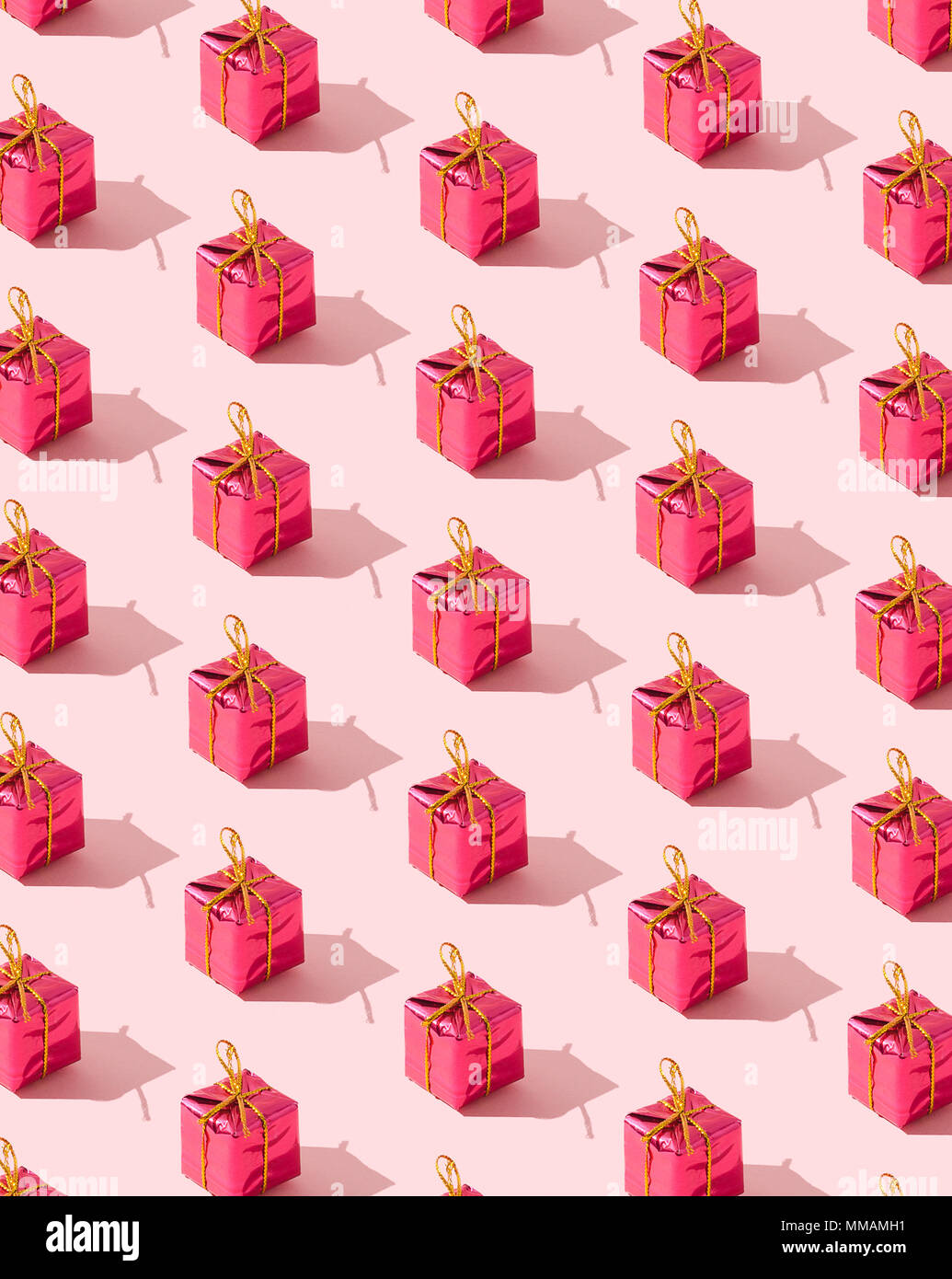 Small gift boxes organized over pink background Stock Photo