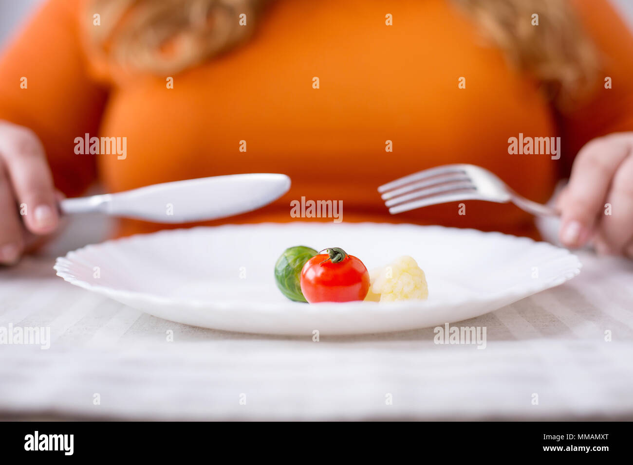 Stout woman being on a healthy diet Stock Photo