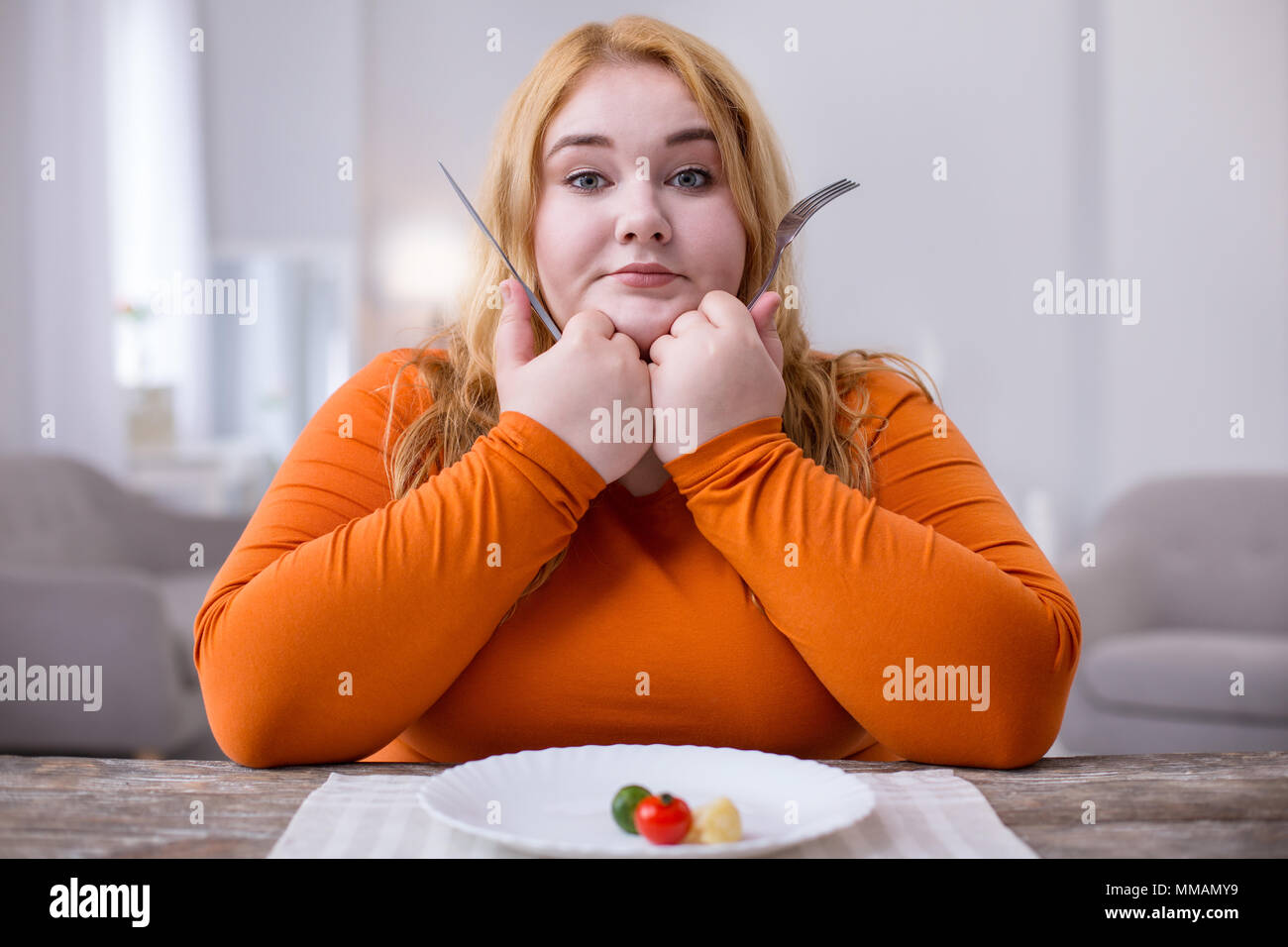 Serious woman being on a healthy diet Stock Photo