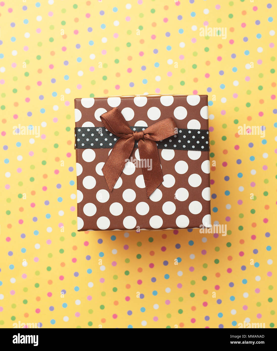 Gift box over a colorful background Stock Photo - Alamy