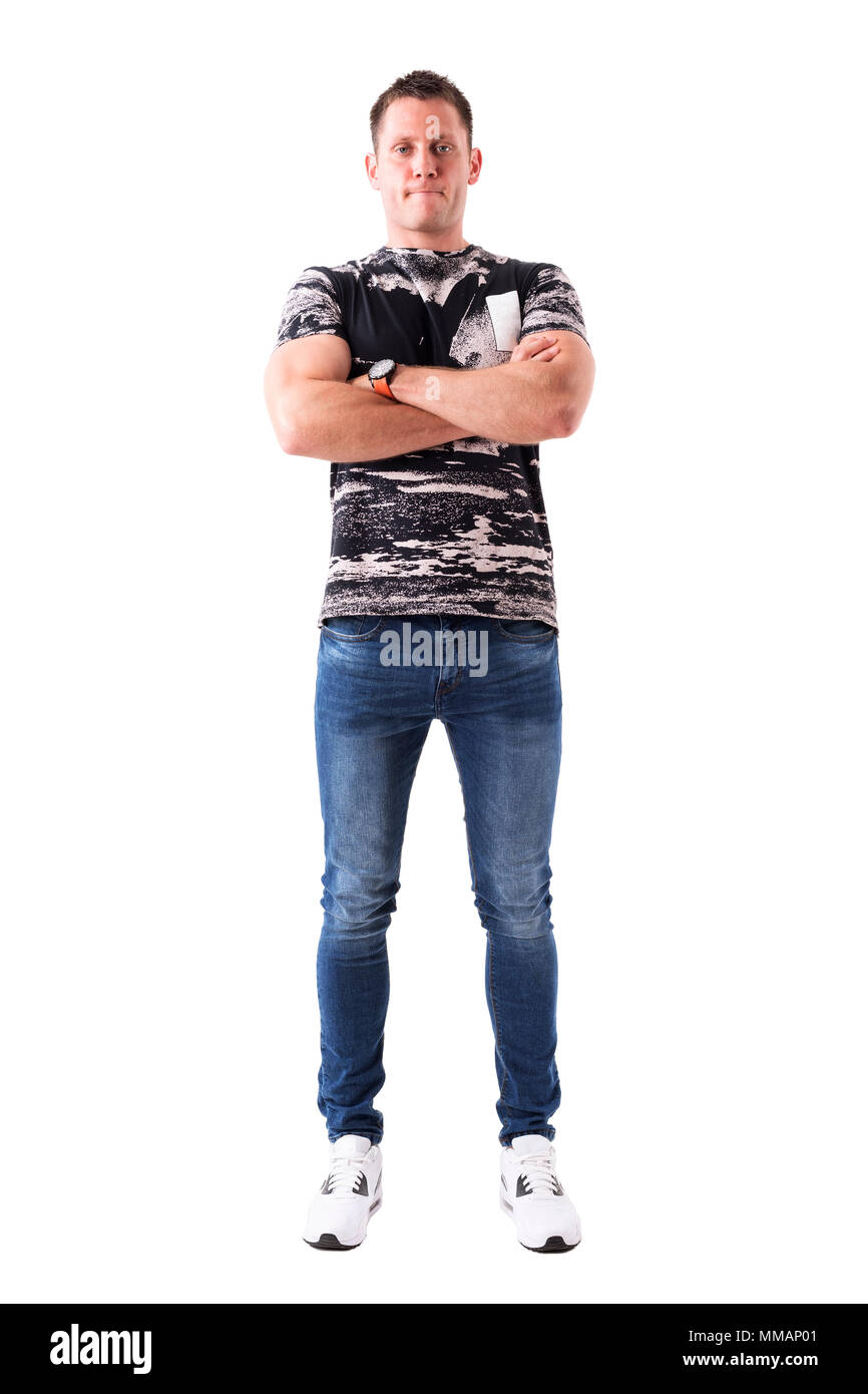 Confident proud casual young adult man with crossed arms looking at ...