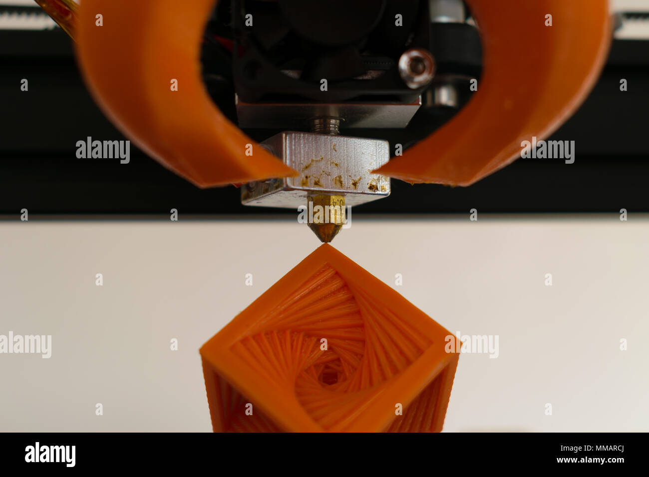 3d printer hot-end nozzle with printed object concept Stock Photo