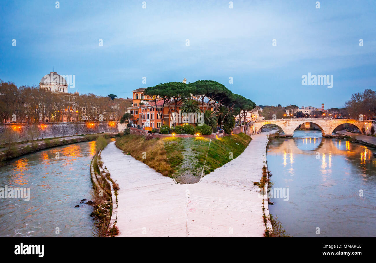 The historical Tiber island from the Garibaldi Bridge in Rome. Stock Photo
