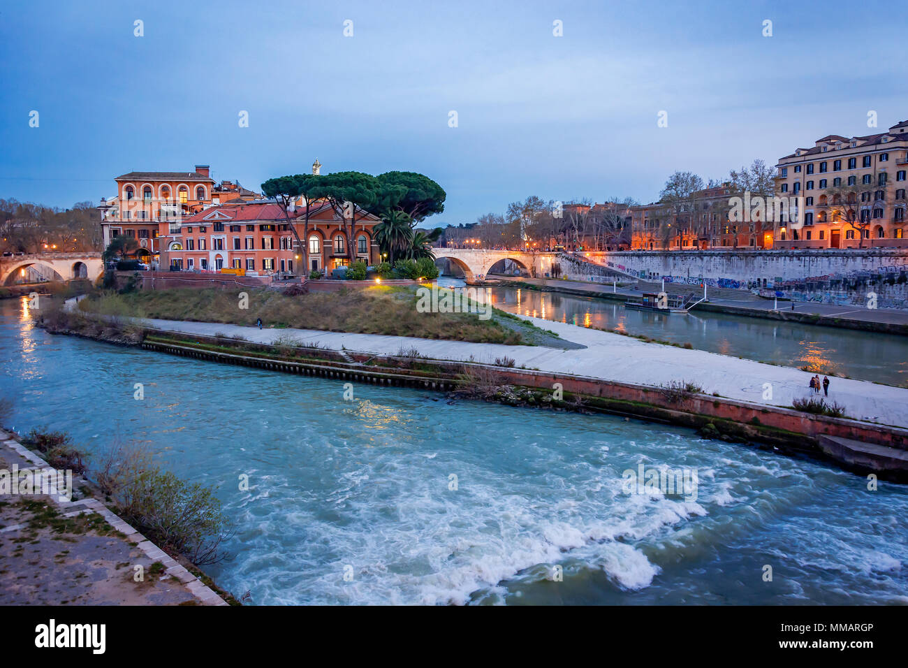 The historical Tiber island from the Garibaldi Bridge in Rome. Stock Photo