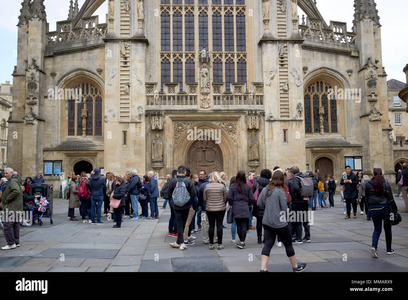 abbey churchyard in front of bath abbey busy with tourists and walking tour groups Bath England UK Stock Photo