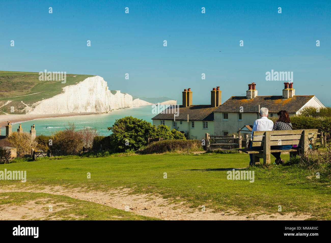 Spring afternoon at Coastguard Cottages, East Sussex. Seven Sisters cliffs in the distance. Stock Photo