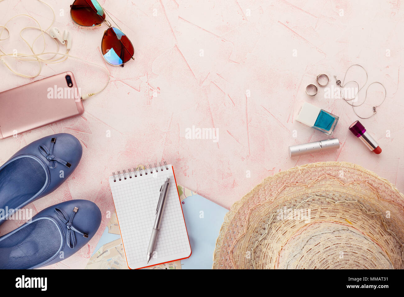 Outfit and accessories of traveler on pink background with copy space, Travel concept. Stock Photo