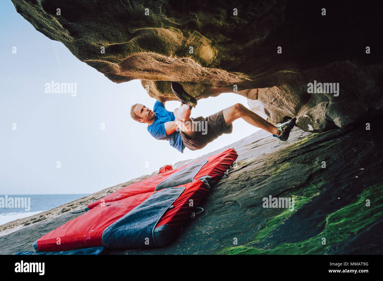 Young Boulder Climber Man Climbing The Rock At Tha Coast With