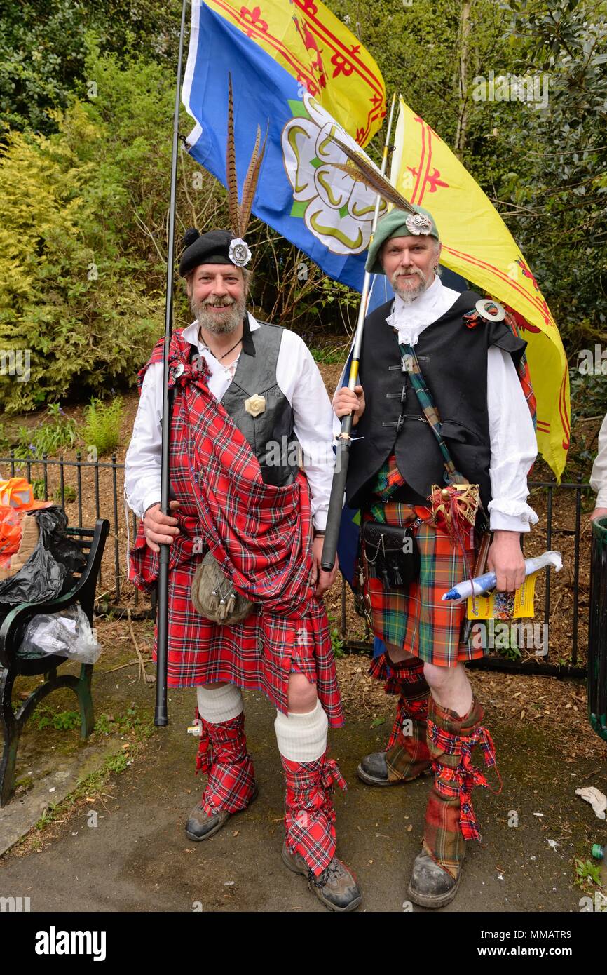 Two men dressed in traditional Scottish garb and carrying Scottish flags at an independence rally and march in Glasgow, Scotland, UK Stock Photo