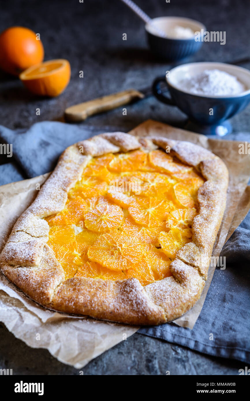 Homemade whole meal Galette with orange slices Stock Photo