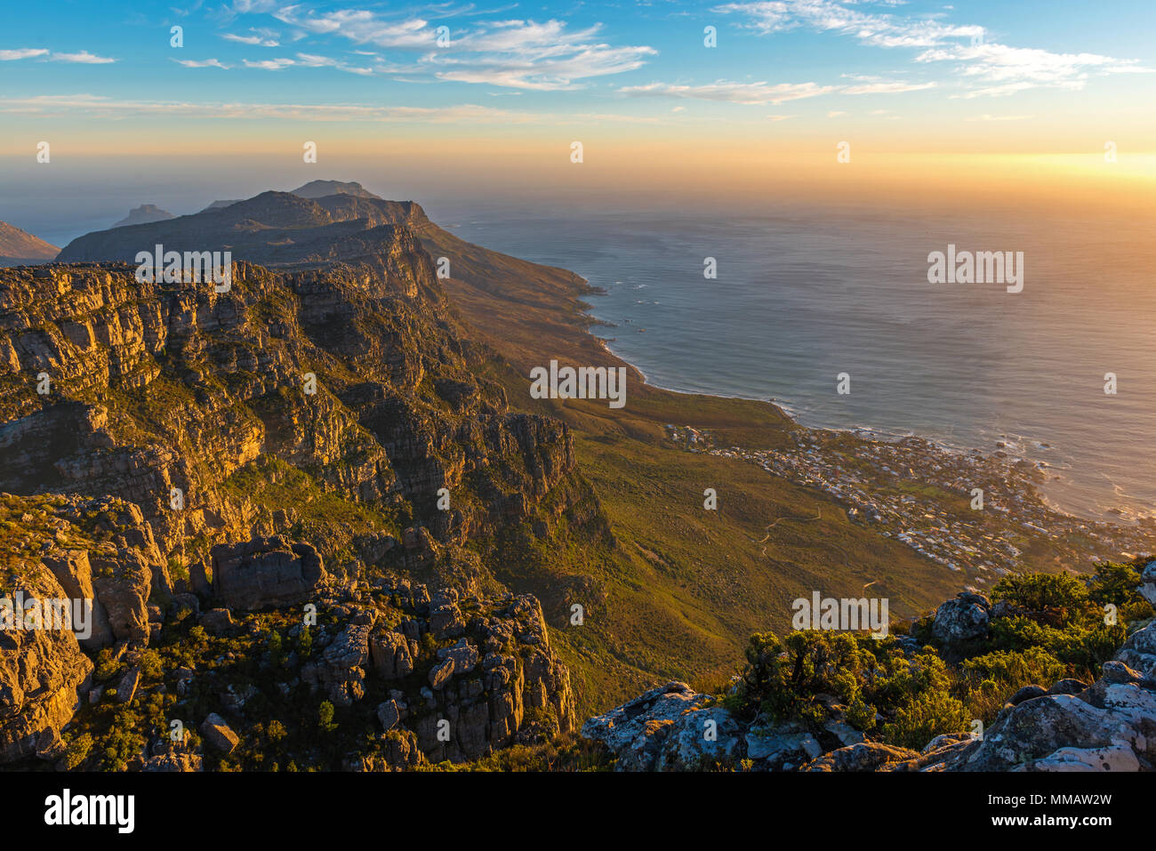 Aerial view of Cape Town's cityscape at sunset seen from the Table Mountain national park giving a sense of infinity, South Africa. Stock Photo