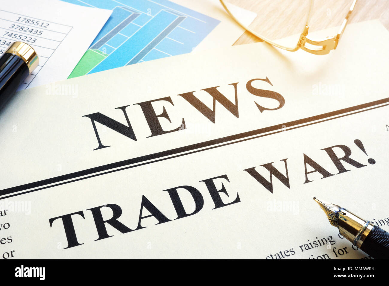 Newspaper with title Trade war on a desk. Stock Photo