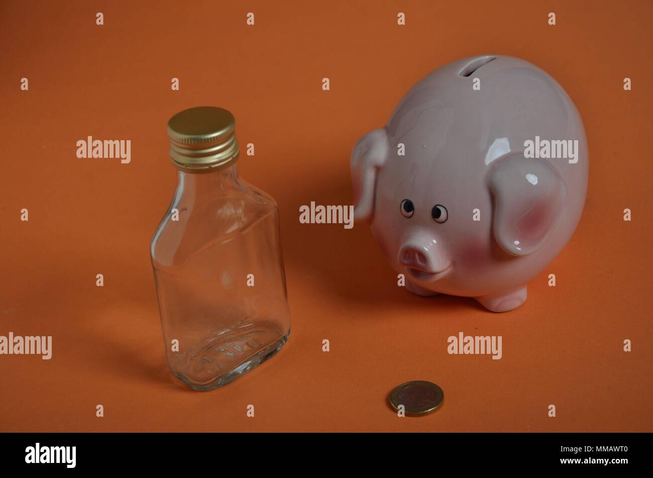 Drinking problem and piggy bank and coin Stock Photo