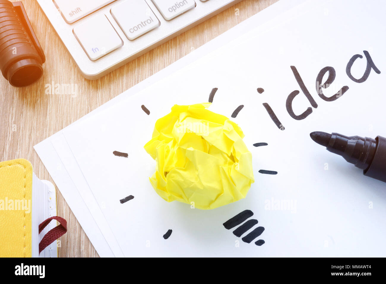 Yellow paper like a bulb as an idea concept. Inspiration. Stock Photo