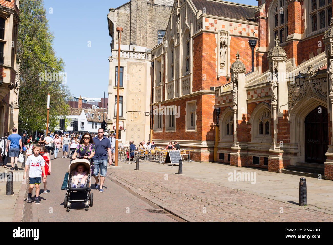 Cambridge, UK -April 2018. People and families walking next to Old Divinity School in St Johns street, central Cambridge city centre Stock Photo