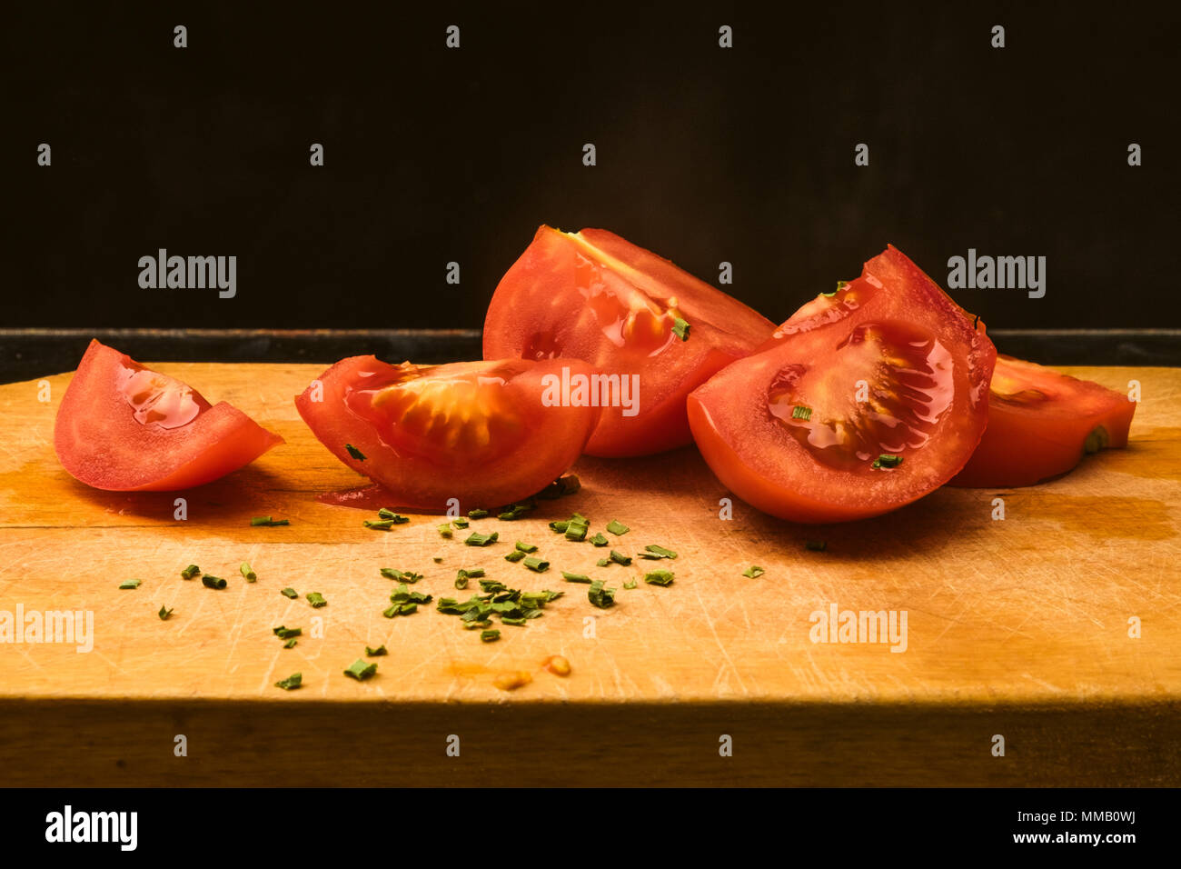 Tomatoes on a cutting board Stock Photo - Alamy