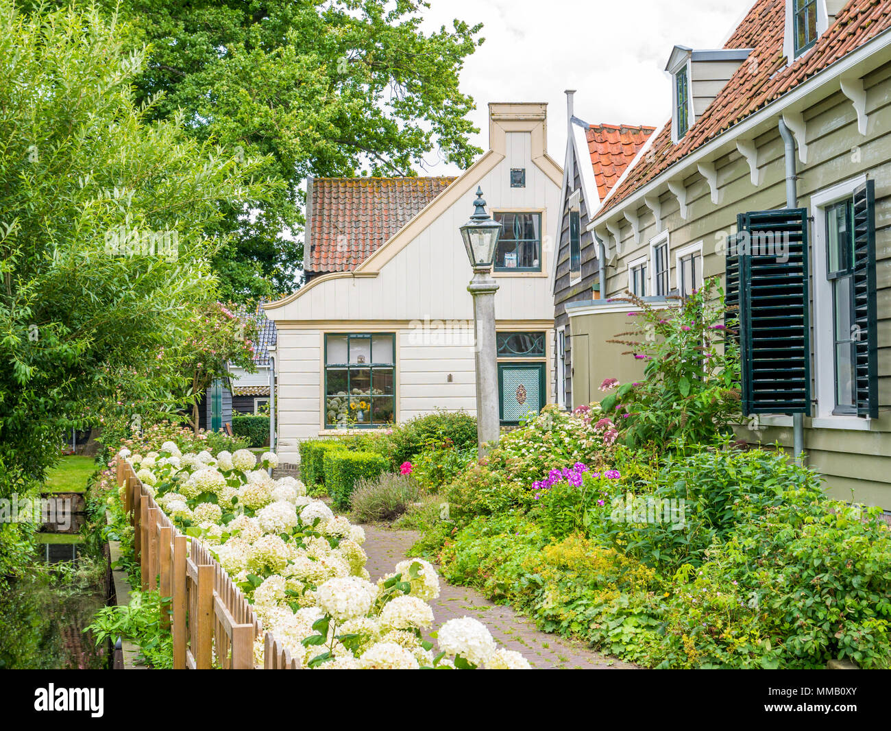 Wooden house and garden with plants and flowers in picturesque old town of Broek in Waterland, Noord-Holland, Netherlands Stock Photo
