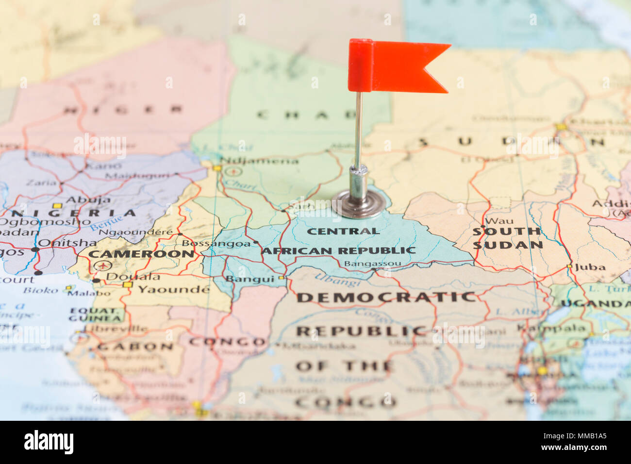 Small red flag marking the African country of the Central African Republic on a world map. Stock Photo