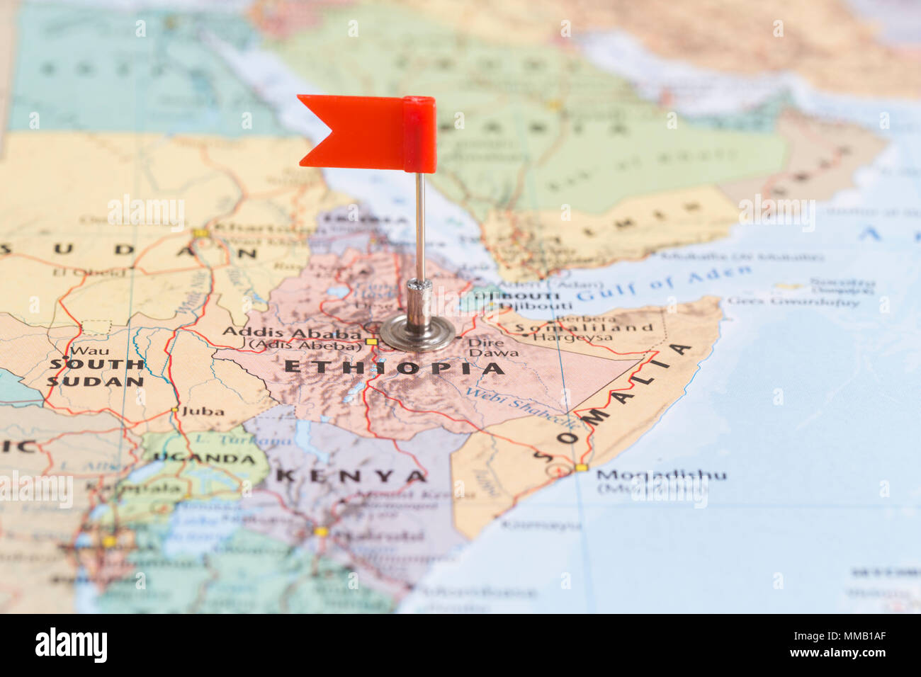 Small red flag marking the African country of  Ethiopia on a world map. Stock Photo