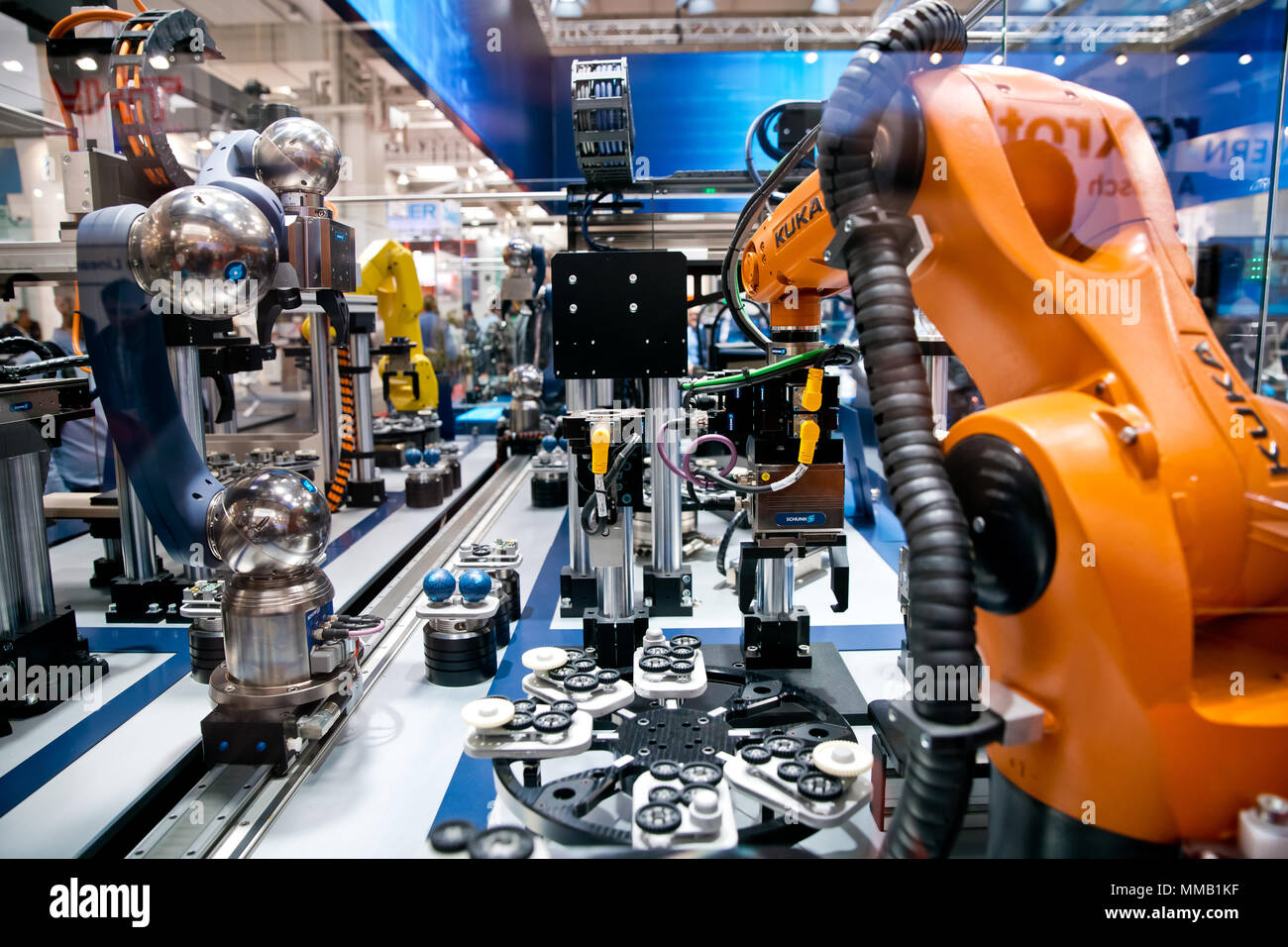 Hannover, Germany - April, 2018: Schunk assembly electronics line with robots on Messe fair in Hannover, Germany Stock Photo