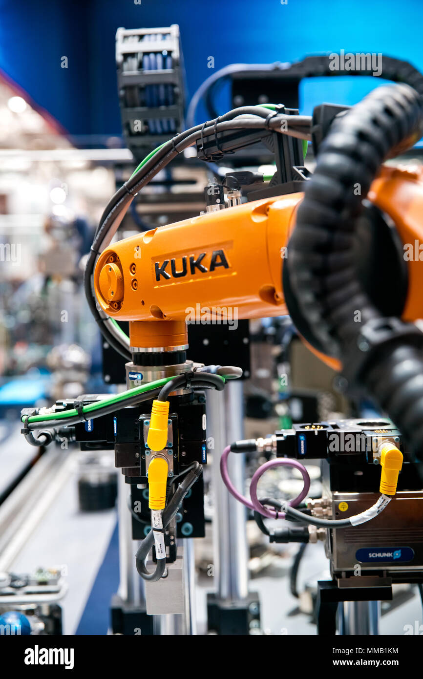 Hannover, Germany - April, 2018: Kuka robot on Schunk assembly electronics line on Messe fair in Hannover, Germany Stock Photo
