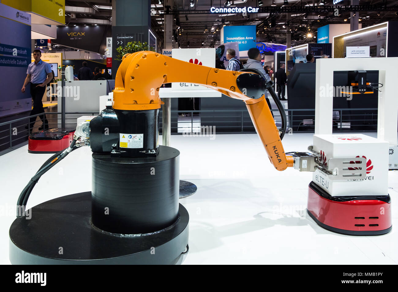 Hannover, Germany - April, 2018: Kuka industrial robot on Huawei booth stand on Messe fair in Hannover, Germany Stock Photo