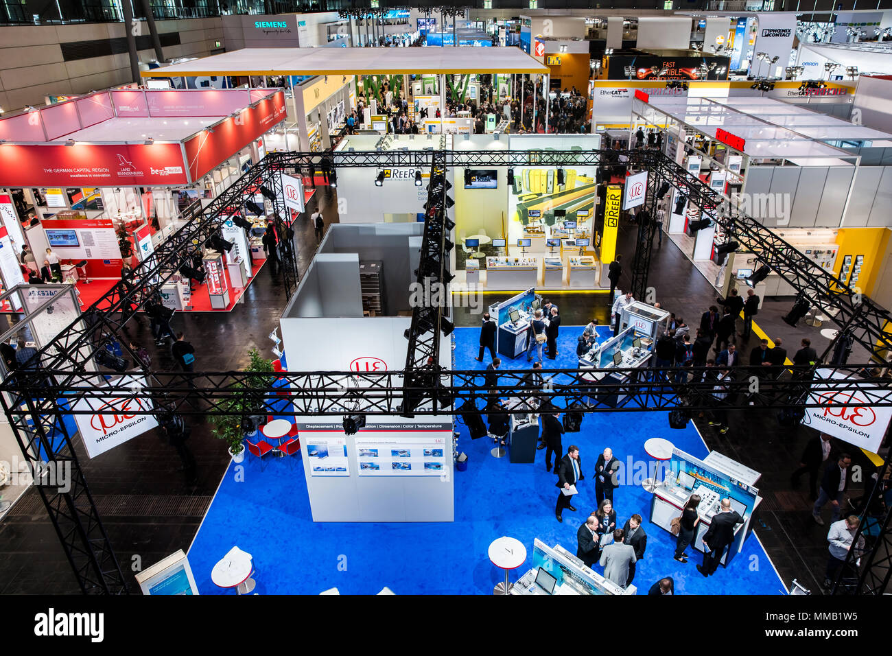 Hannover, Germany - April, 2018: Visitors in exhibition stands and booths on Messe fair in Hannover, Germany Stock Photo