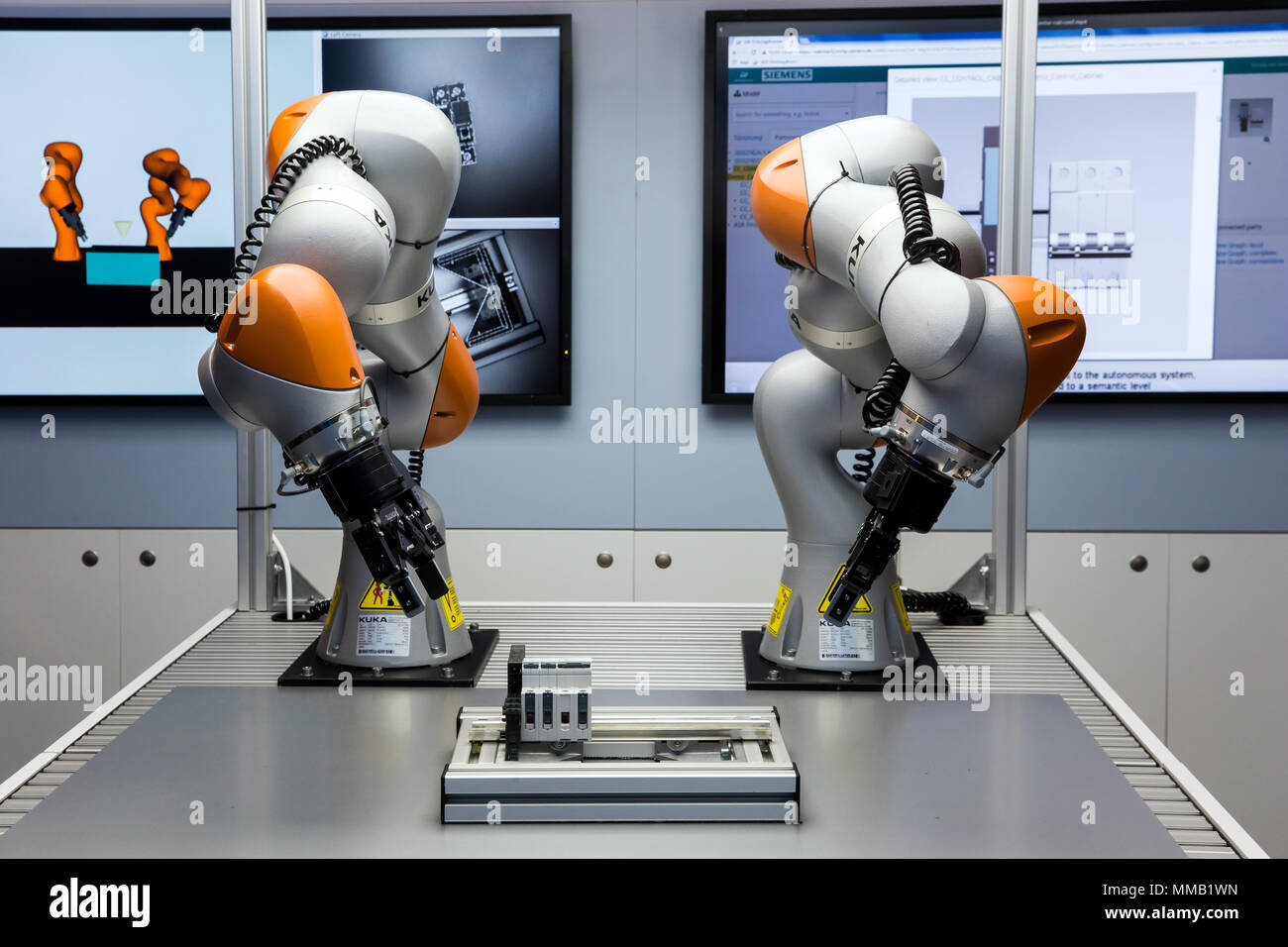 Hannover, Germany - April, 2018: Future of automation, autonomous system with Kuka robots on Siemens stand on Messe fair in Hannover, Germany Stock Photo