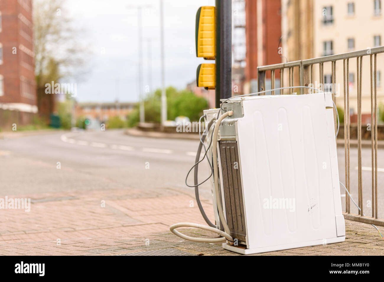 Abandoned Washing Machine or Tumble Dryer on English Street Road. Stock Photo