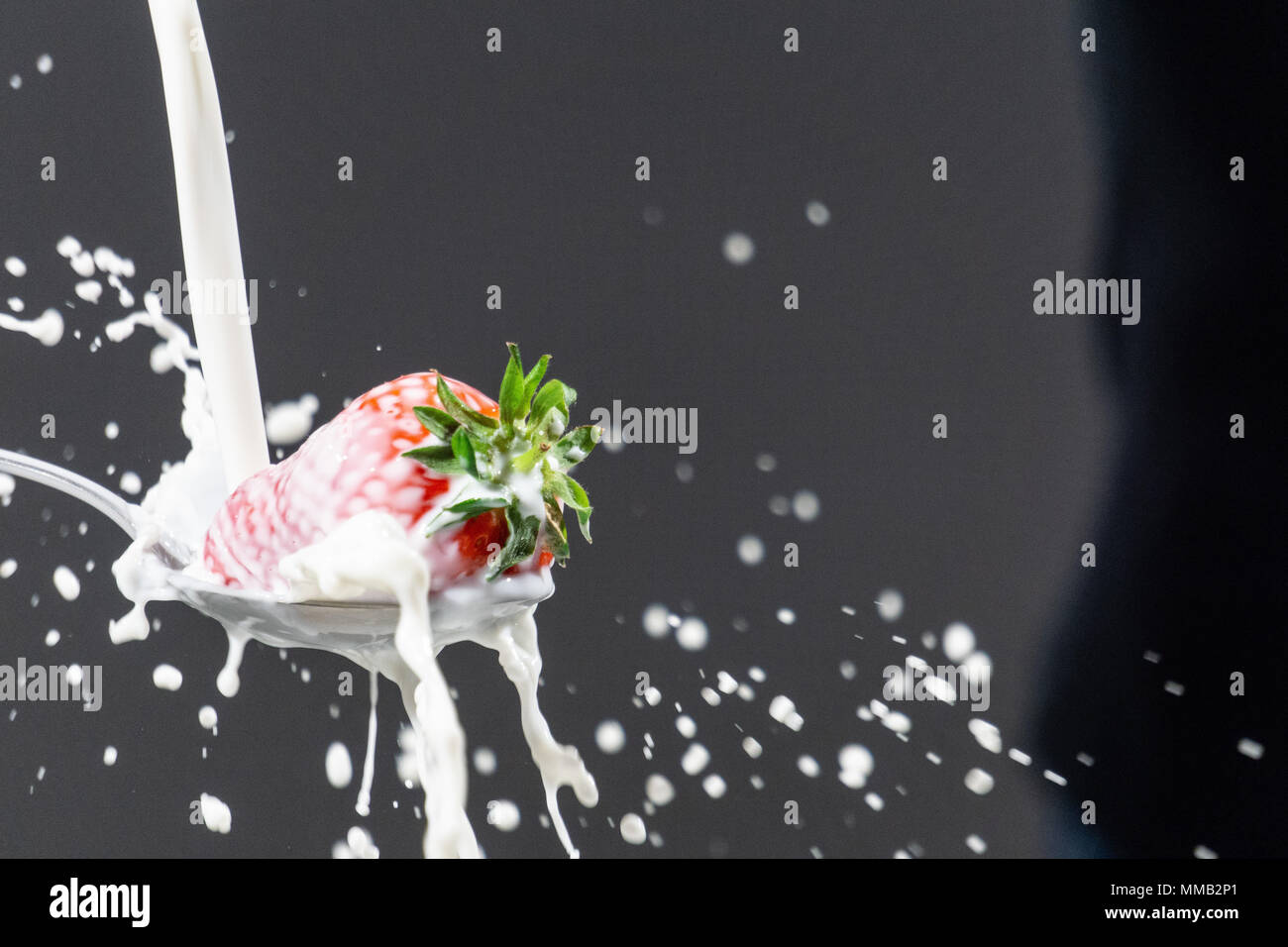 Strawberry with milk. Splash photography Stock Photo