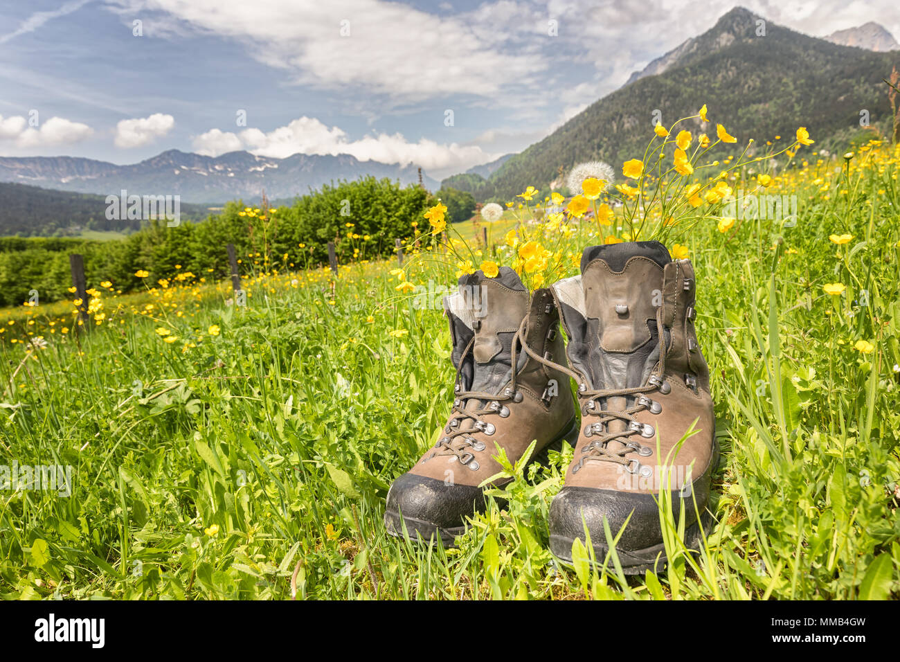 hiking boots on a meadow Stock Photo